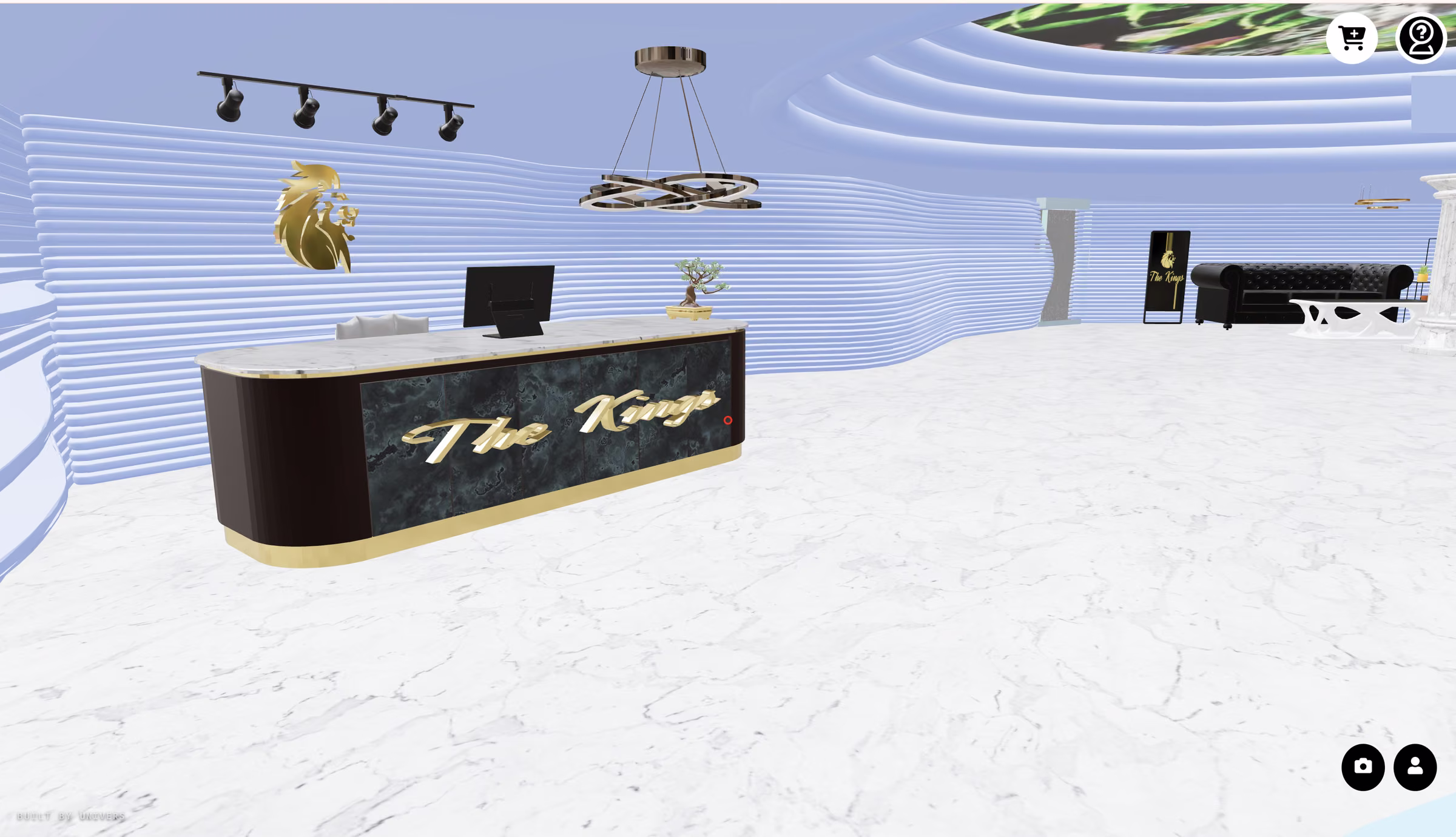 The store counter finished in dark stone with gold lettering, under directional track lighting